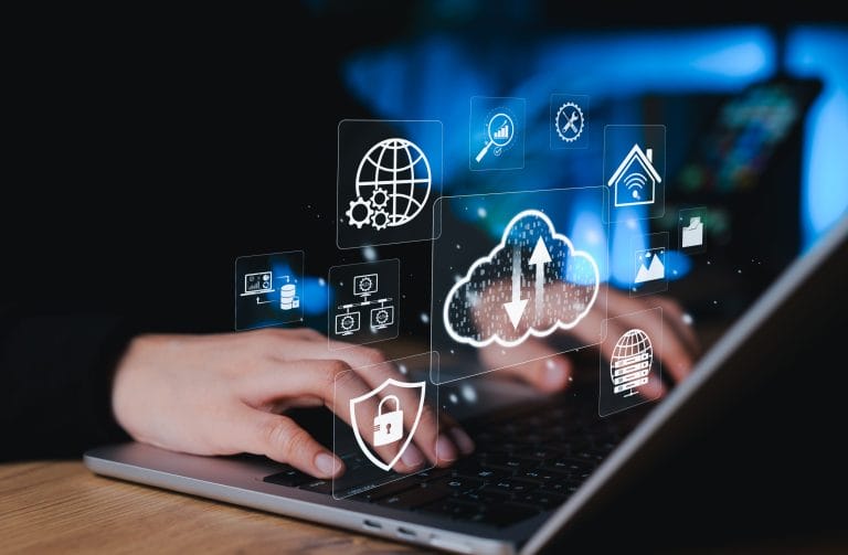 Cloud hosting icons over laptop.